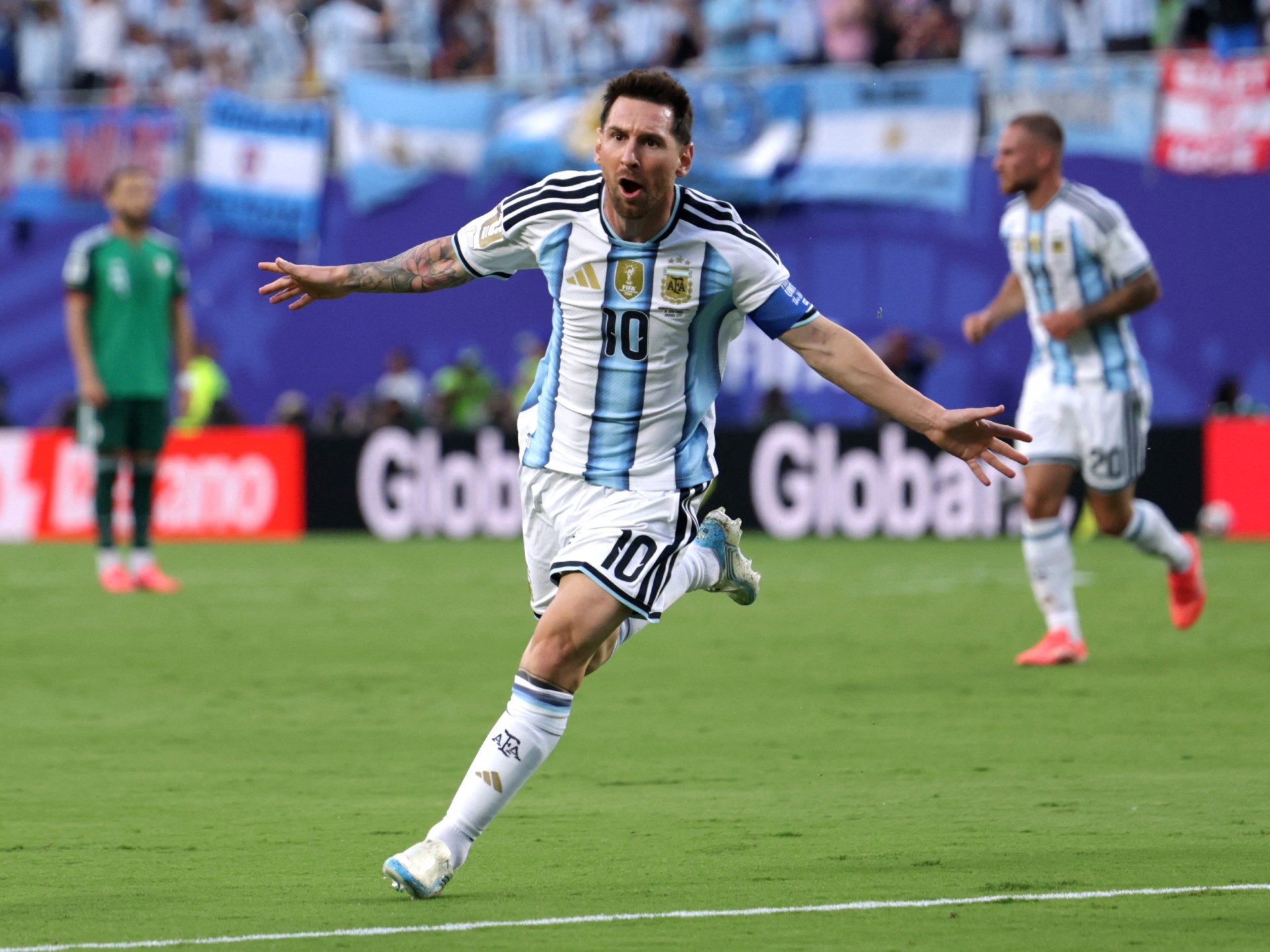 Lionel Messi celebrating for Argentina during the World Cup match against Algeria.